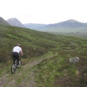 Once at the bottom of the weasel track the return to the Glencoe Ski Centre car park is on the old military road. Excellent mountain biking. Buachaille Etive Mor coming into view.